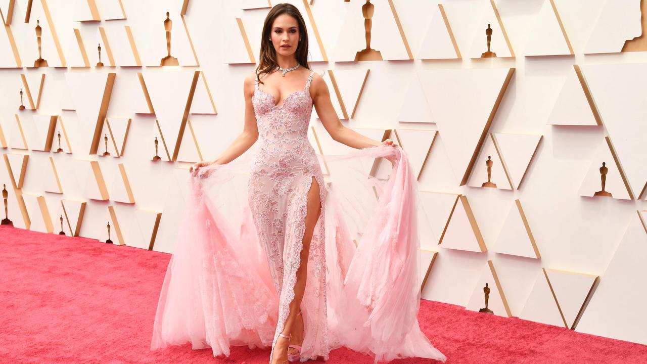 English actress Lily James sizzles in pale pink Atelier Versace and sky high platform heels. Picture: AFP