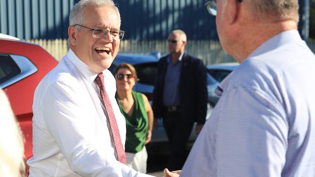 The Liberal National Coalition has pledged 20 Commonwealth-supported medical student placements for the Cairns University Hospital, should it win the May 21 election. Prime Minister Scott Morrison shakes hands with Member for Leichhardt Warren Entsch at the Cairns and District Darts Association Hall. Picture: Brendan Radke