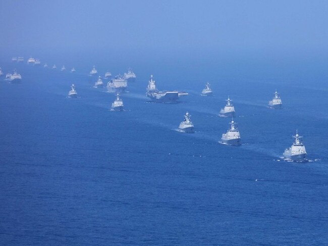 A formation of Chinese warships parade for President-for-life Xi Jinping earlier this month. Picture: Xinhua