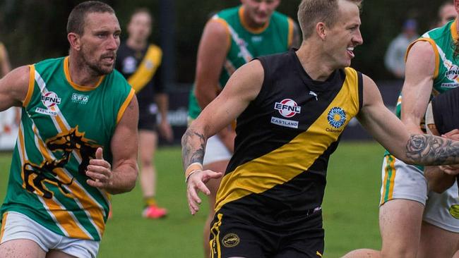 Hocking (left) hunts a Mitcham opponent. Picture: Mitcham Football Club