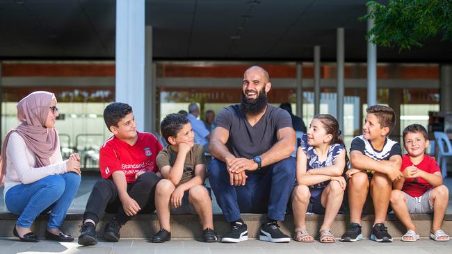 Bachar Houli in Newport, with Amani El Kurdi (left) and younger fans, to announce a funding for a new interfaith community centre. Picture: Mark Stewart