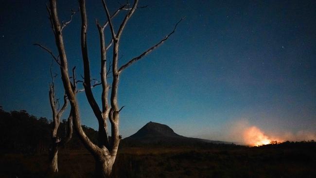 View from the summit of Mt Oakleigh showing the southern fire front on the flanks of Pelion West. The bushfire has now impacted the Overland Track in the Cradle Mountain-Lake St Clair National Park. Picture: Shaun Mittwollen