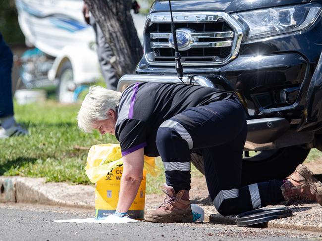 A contractor from the Forensic Cleaning Services at work at the scene on Saturday. Picture: Julian Andrews