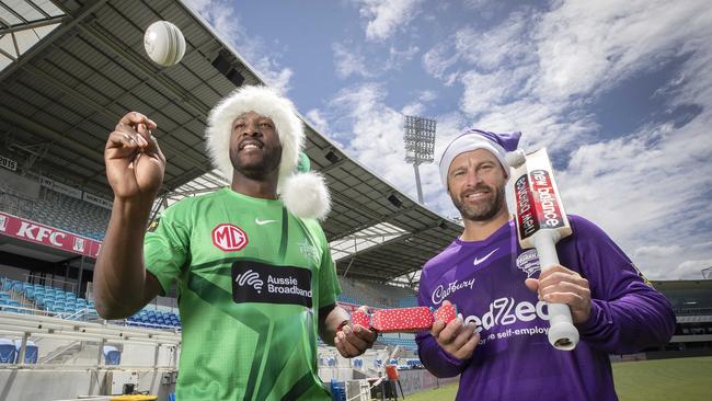 Melbourne Stars’ Andre Russell and Hobart Hurricanes captain Matthew Wade at Blundstone Arena ahead of the Christmas Eve Big Bash game. Picture: Chris Kidd