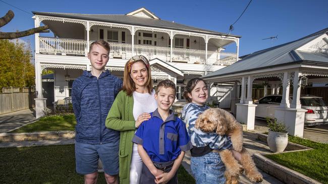 Ethan, Justine, Dante and Allegra Campbell pictured outside their new Bullimba home. Picture: Glenn Hunt