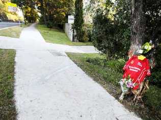 Flowers and a Red Devils Rugby League Club guernsey mark the site where 20-year-old Ben Donohoe lost his life in a car accident on the Bangalow Road at Byron Bay early yesterday morning. . Picture: Cathy Adams