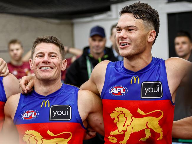 MELBOURNE, AUSTRALIA - JUNE 07: Dayne Zorko and Cam Rayner of the Lions sing the team song during the 2024 AFL Round 13 match between the Western Bulldogs and the Brisbane Lions at Marvel Stadium on June 07, 2024 in Melbourne, Australia. (Photo by Dylan Burns/AFL Photos via Getty Images)