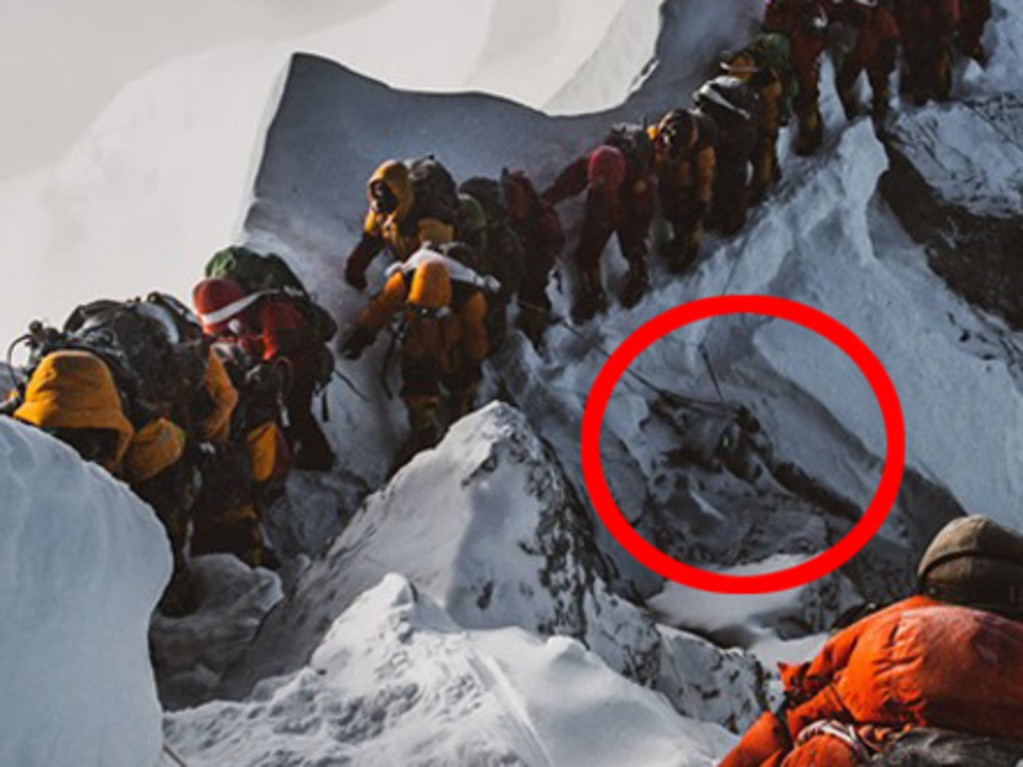 Elia Saikaly’s disturbing photograph shows tourist climbing over a dead body to continue their journey.