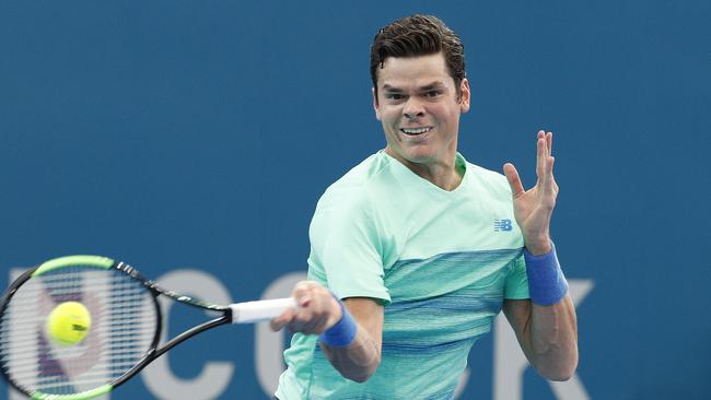 Milos Raonic of Canada returns during his semi-final match against Grigor Dimitrov of Bulgaria at the Brisbane International Tennis Tournament in Brisbane, Saturday, Jan. 07, 2017. (AAP Image/Dave Hunt) NO ARCHIVING, EDITORIAL USE ONLY