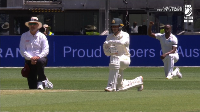 Australia and West Indies players take a knee before play in First Test