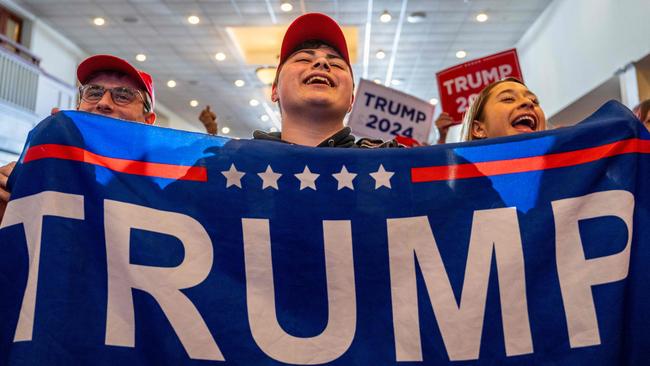 Supporters cheer as Republican presidential candidate, Trump speaks during a campaign rally in New Hampshire. Picture: Brandon Bell/Getty Images/AFP