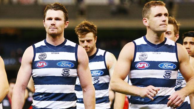 Patrick Dangerfield and Joel Selwood lead the Cats off after their surprising defeat to Essendon. Picture: Getty Images