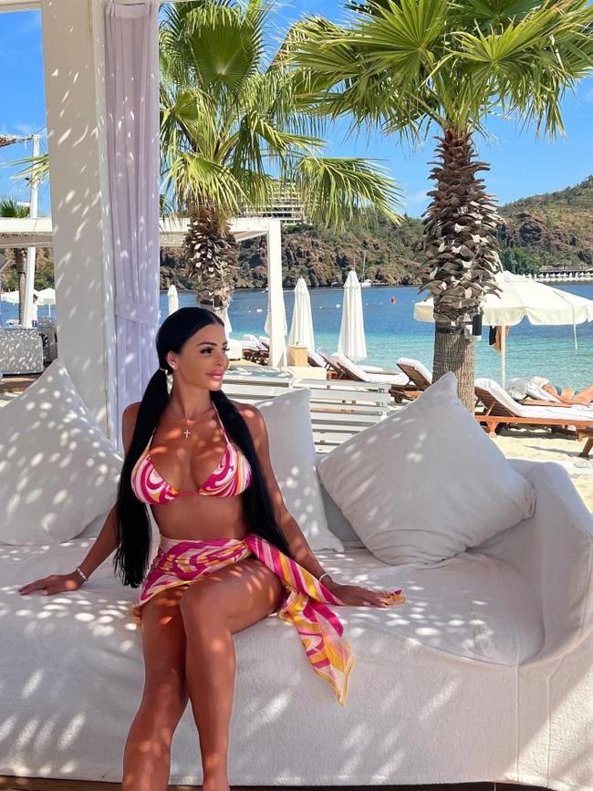 Buddle’s glamorous partner Mel Ter Wisscha by the water at the D.Maris Bay Resort in Turkey.