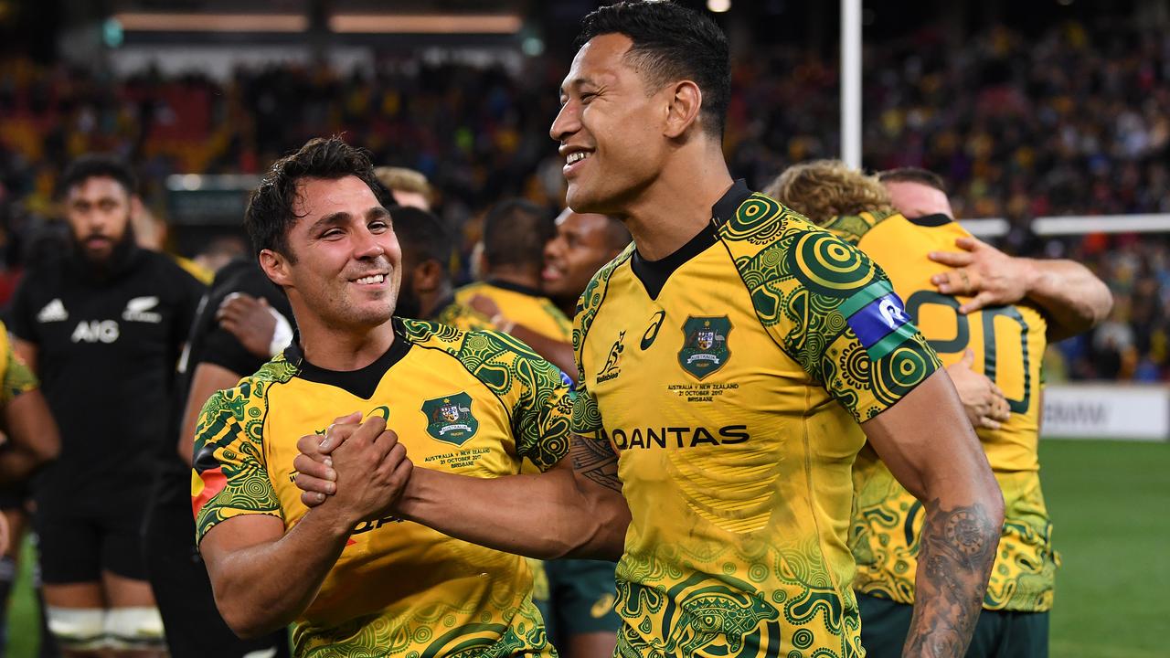 Wallabies Nick Phipps and Israel Folau celebrate at Suncorp Stadium in Brisbane.