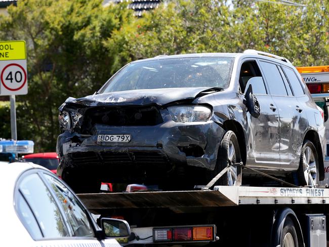 A towing company removes the car involved in the Banksia Road Primary School tragedy in Greenacre last Tuesday. Picture: Jonathan Ng