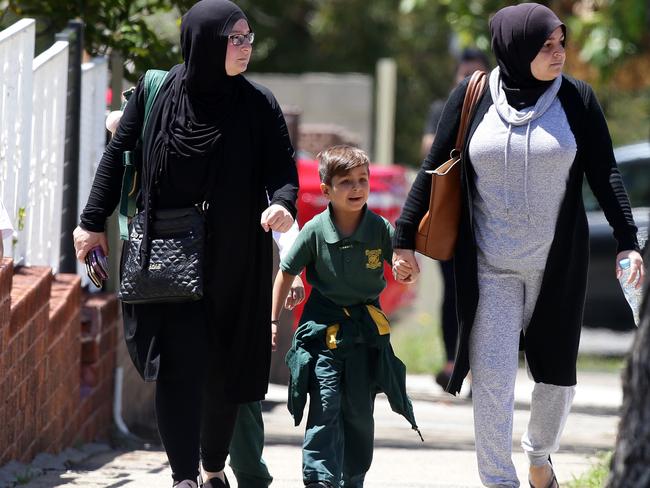 Students leaving with their parents from Banksia Road Primary School in Greenacre.