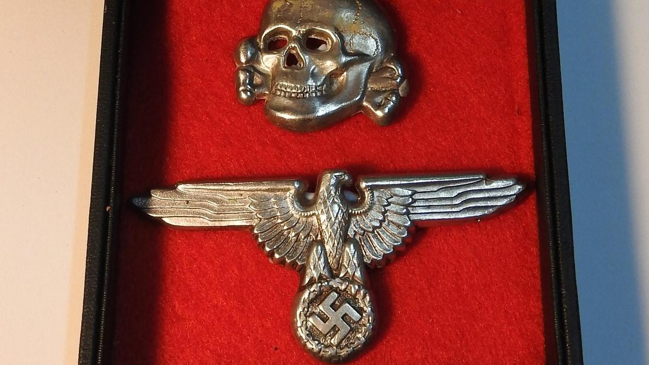 Waffen SS cap insignia Supplied: Danielle Elizabeth Antique &amp; Estate Auctioneers