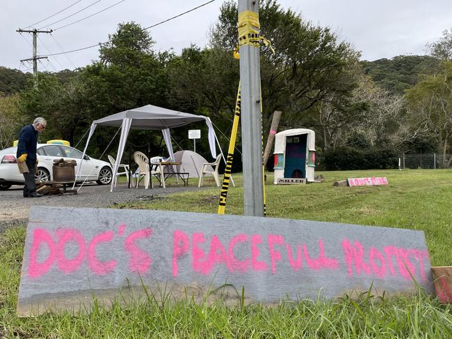 The protest off Tumbi Rd and Nartanda Ave, Wamberal, has prompted a lot of questions over what it’s about. Picture: NewsLocal