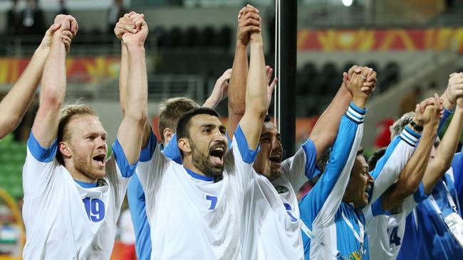 Uzbekistan celebrate qualifying for the Asian Cup quarter-final.