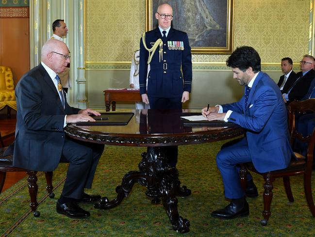 New Minister for Customer Service Victor Dominello is sworn in by NSW Governor David Hurley this week. (AAP Image/Joel Carrett)