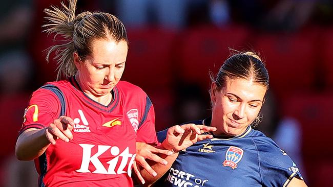 ADELAIDE, AUSTRALIA - MARCH 29: Dylan Holmes  of Adelaide United and Claudia Cicco of the Newcastle Jets during the A-League Women round 22 match between Adelaide United and Newcastle Jets at Coopers Stadium, on March 29, 2024, in Adelaide, Australia. (Photo by Sarah Reed/Getty Images)