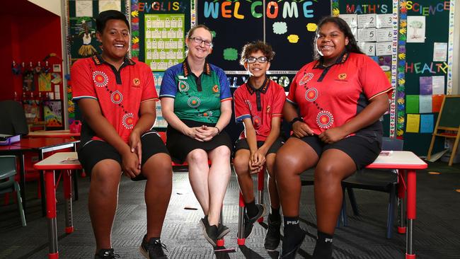 Hymba Yumba at Springfield Lakes has made great gains. Students Cornelius Atonio, 14, Deputy Principal Stephanie Walsh, Carlin Renouf, 13 and Pheona Combo, 15. Pics Adam Head