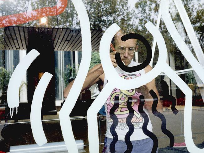 Keith Haring preparing an artwork on the waterwall at the NGV in 1984. Photo: Geoffrey Burke