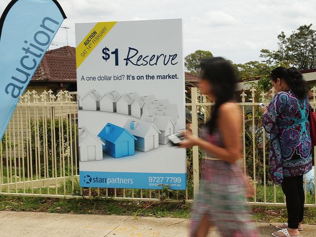 BLACKTOWN, AUSTRALIA - FEBRUARY 14: A sign stands on display before the home auction for a four-bedroom house at 230 Blacktown Road on February 14, 2015 in Blacktown, Australia. The Blacktown home sold for AUD$565,000 at auction today, smashing the reserve set at AUD$1. The Sydney home auction clearance rate is expected to remain high following the Reserve Bank's interest rate cut to 2.25 per cent last week. (Photo by Mark Metcalfe/Getty Images)