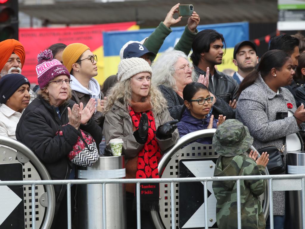 Onlookers pay their respects. Picture: David Crosling