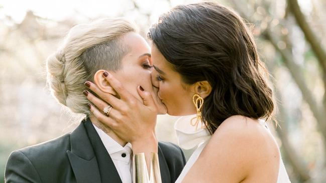 Moana Hope kisses Isabella Carlstrom on their wedding day. Picture: Lovers Narrative