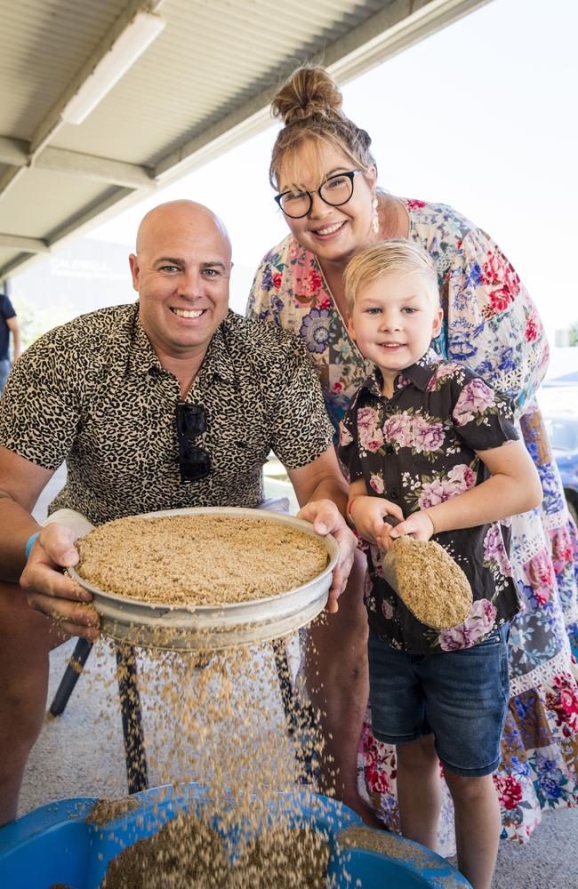 Onyx Mallyon fossicks with parents Joel and Jess Mallyon at Gemfest hosted by Toowoomba Lapidary Club at Centenary Heights State High School, Saturday, October 21, 2023. Picture: Kevin Farmer