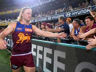 Daniel Rich celebrates with fans after the Lions' opening-round win. Picture: Jono Searle/AFL Photos