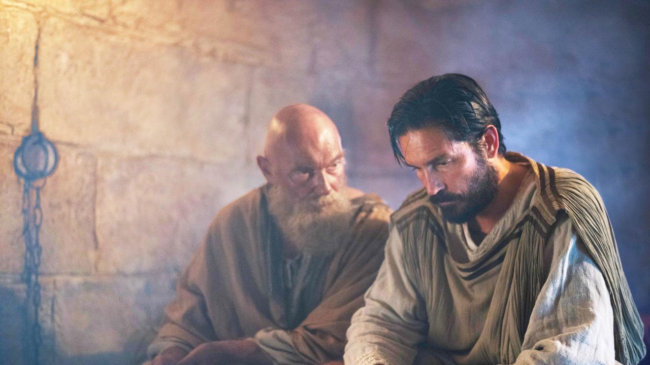 Paul and Luke discover the sorry state of play of Rome in the year 67 A.D. in a scene from <i>Paul, Apostle of Christ</i>.