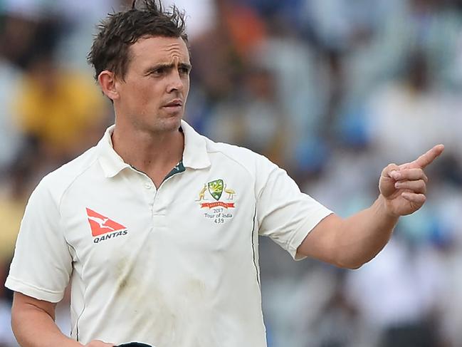 Australian bowler Stephen O'Keefe gestures as he speaks with captain Steve Smith during the second day of the third Test cricket match between India and Australia at The Jharkhand State Cricket Association (JSCA) Stadium Complex in Ranchi on March 17, 2017. ----IMAGE RESTRICTED TO EDITORIAL USE - STRICTLY NO COMMERCIAL USE----- / GETTYOUT---- / AFP PHOTO / SAJJAD HUSSAIN / ----IMAGE RESTRICTED TO EDITORIAL USE - STRICTLY NO COMMERCIAL USE----- / GETTYOUT