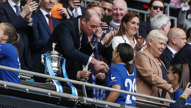 Prince Williams shakes the hand of Sam Kerr during the Women's FA Cup Final presentations. Photo by Charlotte Wilson/Offside/Offside via Getty Images.