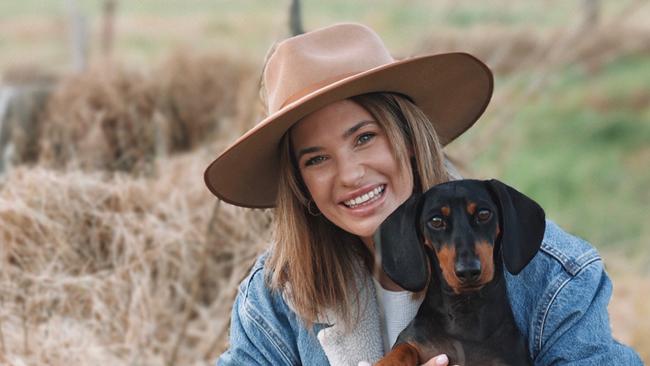 Gold Coast woman Brittany Morris with her dog Bruce.