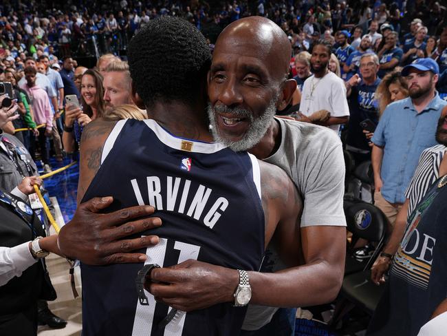 DALLAS, TX - MAY 26: Kyrie Irving #11 of the Dallas Mavericks greets his father, Drederick Irving after the game  against the Minnesota Timberwolves during Game 3 of the Western Conference Finals of the 2024 NBA Playoffs on May 26, 2024 at the American Airlines Center in Dallas, Texas. NOTE TO USER: User expressly acknowledges and agrees that, by downloading and or using this photograph, User is consenting to the terms and conditions of the Getty Images License Agreement. Mandatory Copyright Notice: Copyright 2024 NBAE (Photo by Jesse D. Garrabrant/NBAE via Getty Images)