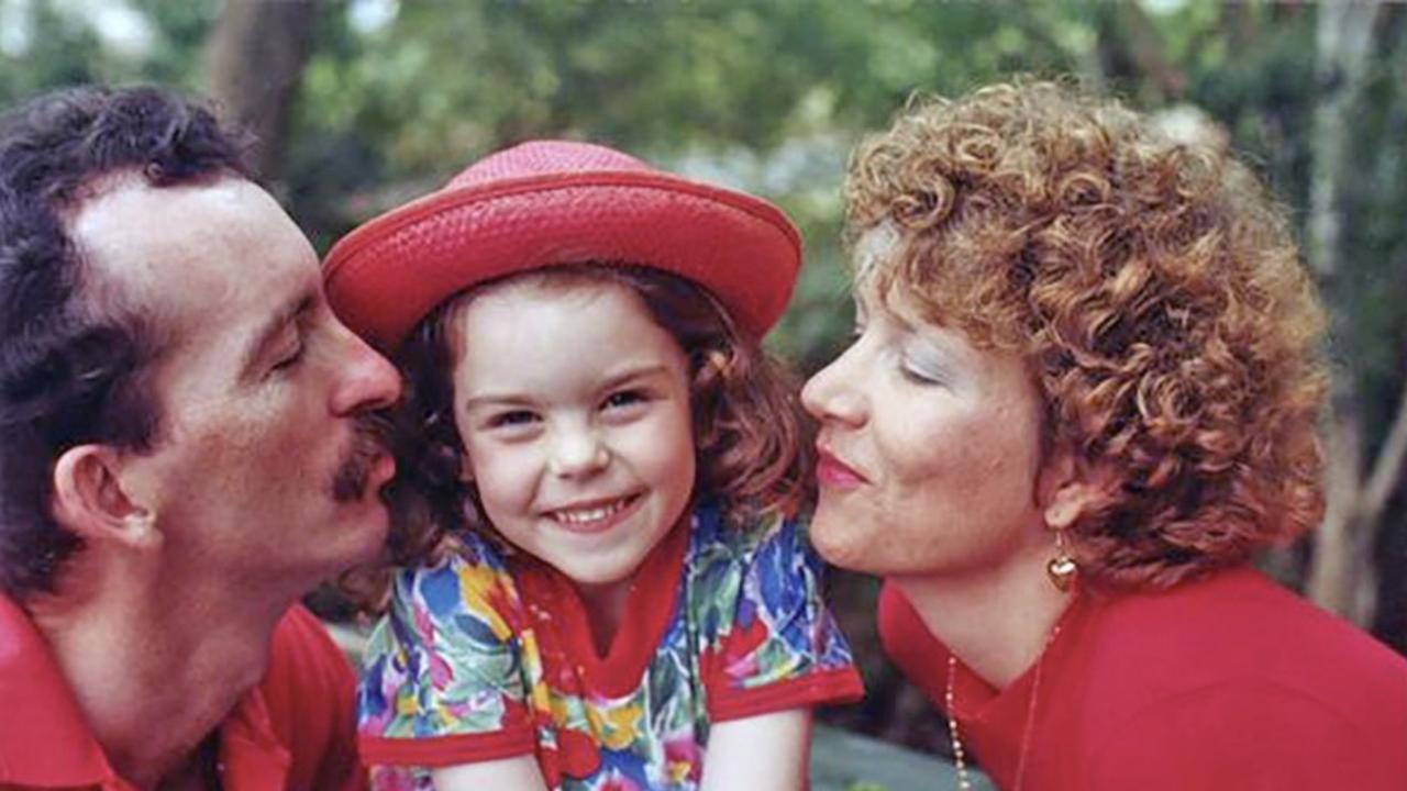 Kari with her parents Peter and Rhyl in 1994. She had big curls and the cutest smile.