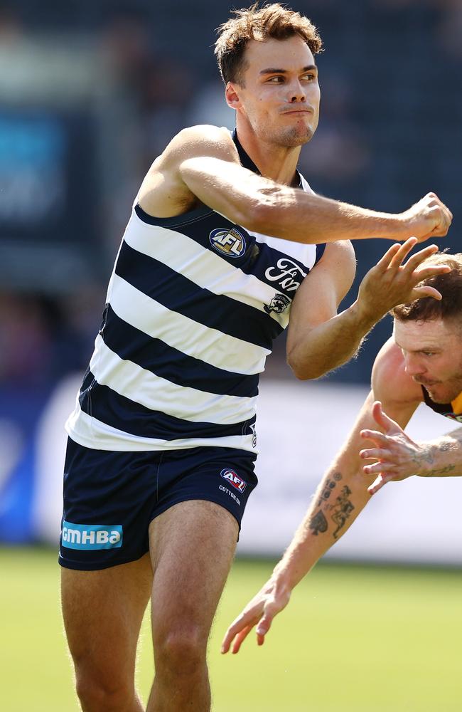 Jack Bowes fires a handball in an early Cats outing. Picture: Michael Klein