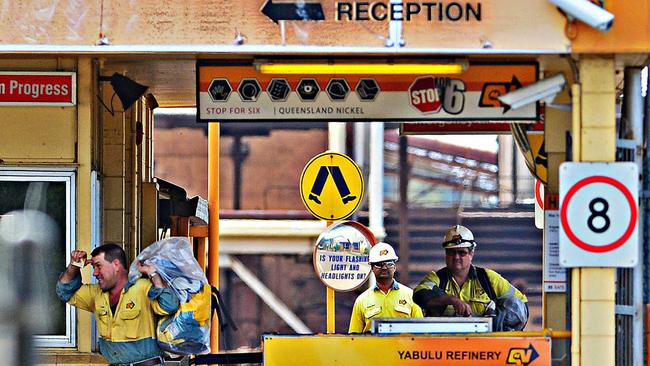 Queensland Nickel workers leave the Yabulu refinery for the last time with their belongings. Picture: Zak Simmonds