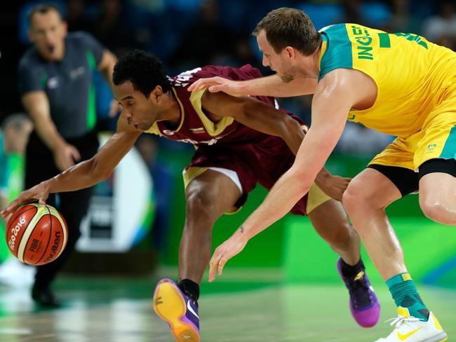 RIO DE JANEIRO, BRAZIL - AUGUST 14: Jhon Cox #6 of Venezuela and Joe Ingles #7 of Australia compete for a loose ball during the preliminary round game at the Rio 2016 Olympic Games on August 14, 2016 in Rio de Janeiro, Brazil. (Photo by Jamie Squire/Getty Images)