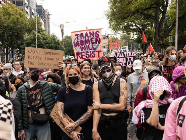 Pro-trans activists gather along Spring Street. Picture: NewsWire / Diego Fedele
