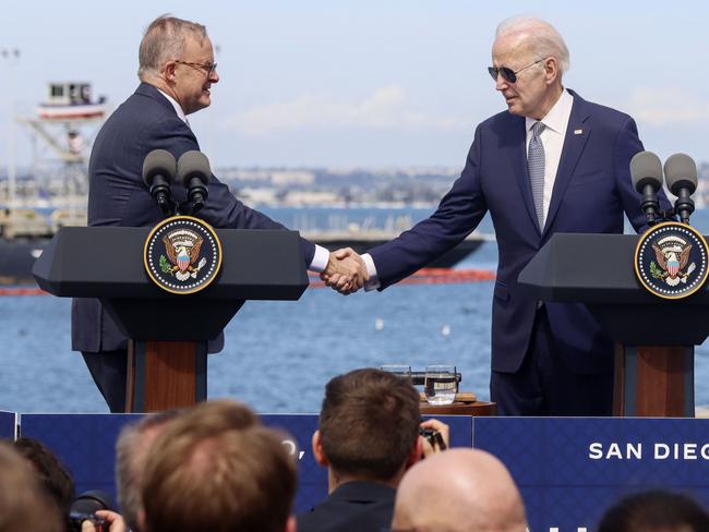 Anthony Albanese and Joe Biden shake hands at Submarine Base Point Loma, San Diego, California after the historic deal was announced. Picture: Sandy Huffaker for News Corp