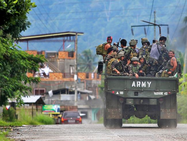 Soldiers head back to the front lines in Marawi. The Battle of Marawi is ongoing between the Philippines Army and the ISIS terrorists. Picture: Gary Ramage