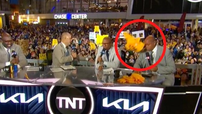 Charles Barkley is pelted with t-shirts.