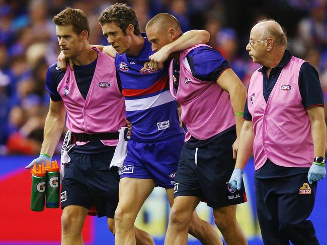 Robert Murphy is helped from the ground. Picture: Getty Images