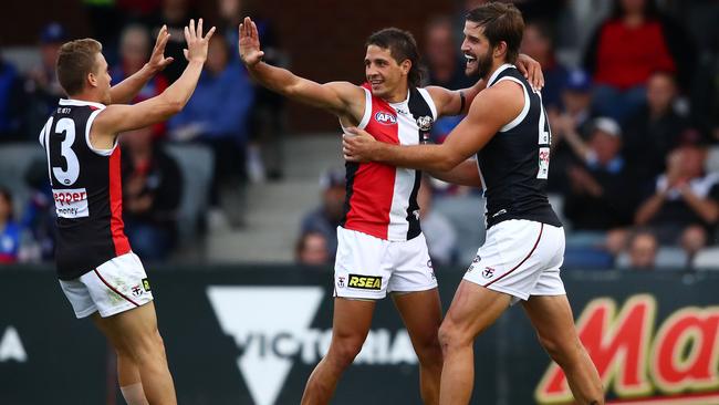 Ben Long, Josh Bruce and Jack Lonie celebrate a goal during the JLT Series. Picture: Scott Barbour/Getty Images.
