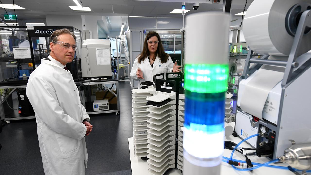 Federal Health Minister Greg Hunt (left) tours the National Drug Discovery Centre at the Walter and Eliza Hall Institute of Medical Research in Melbourne. Picture AAP