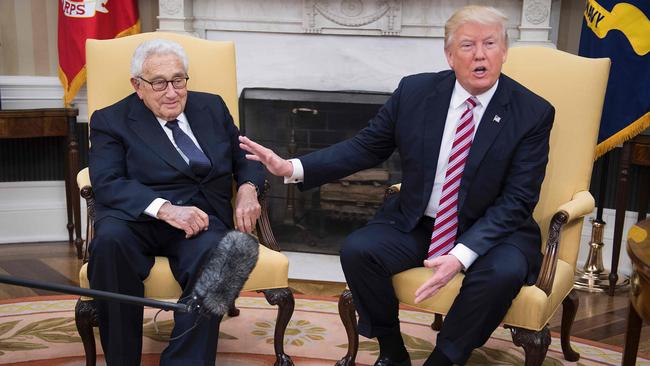 Henry Kissinger in the Oval Office with Donald Trump. Picture: AFP