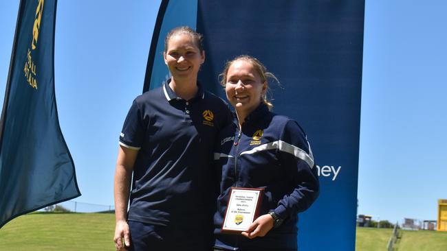 Jessica Jensen receiving the Under 14 Referee of the Tournament from Lead Referee Coach, Danielle Anderson.